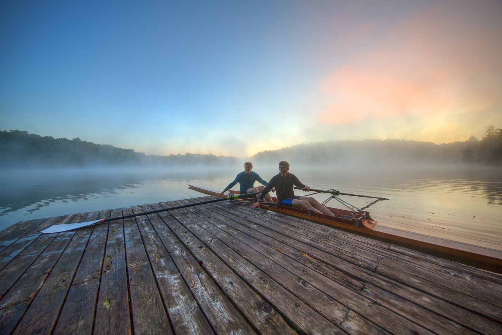 Founders Dick and Peter continue to innovate and personally test each product. Here they are heading out for an early morning oar-testing session in their 1984 wooden Stämpfli pair on Big Hosmer Pond, Craftsbury, Vermont.