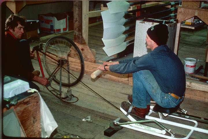 Peter and Dick decide to create a winter training device for rowers. They nail an old bicycle to the floor of the barn and pull on the free end of the chain—the Model A Indoor Rower is born.<br><br><i>Dick Dreissigacker (l.) and Jon Williams (r.). Jon is still at Concept2!</i>