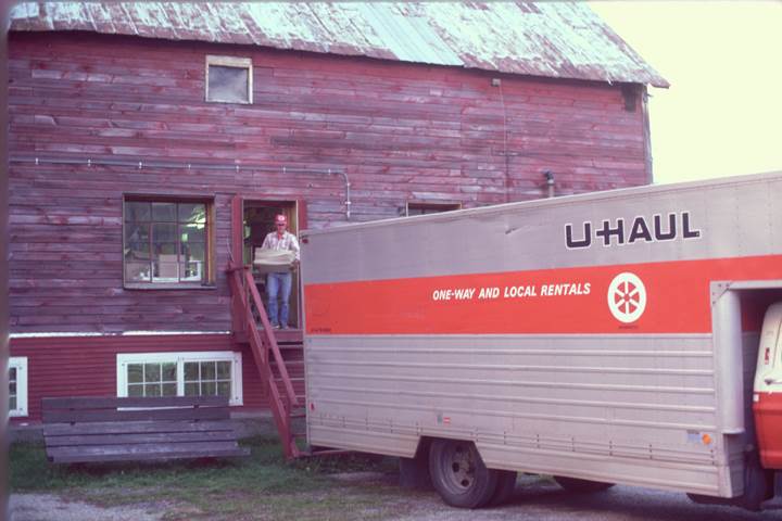 Concept2 grows too big for the barn and moves to the Morrisville Industrial Park. The neighbors are a craft paint supplier and a wood stove company. There’s also a great view of Vermont’s highest peak, Mount Mansfield.<br><br><i>Lester Farr loading the U-Haul. Lester retired in 2015.</i>